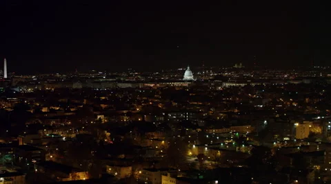 Flying above Washington DC at night toward and over Southwest Freeway and Stock Footage