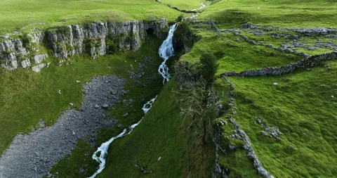 Flying above a waterfall on a hillside Video stock 321274726