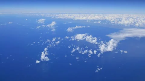 Flying above white clouds on blue sky and earth time-lapse - motion background Stock Footage 8836560