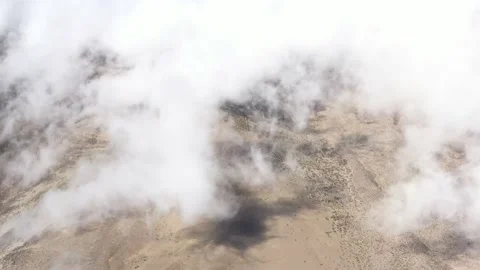 Flying above white clouds showing a stunning view of clouds slowly moving over Stock Footage 142751886