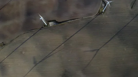 Flying Above Wind Turbines In A Wind Farm Energy Production On Open Grass Field Stock Footage 138442210