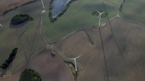 Flying Above Wind Turbines In A Wind Farm Energy Production On Open Grass Field Stock Footage 138442814
