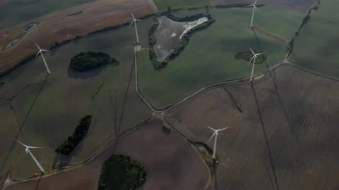 Flying Above Wind Turbines In A Wind Farm Energy Production On Open Grass Field Stock-Footage 138442928