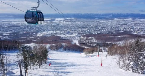 Flying abve the ski slope of ski resort and aerial view of ski lift elevator Stock Footage 88485834