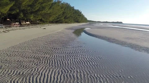 Flying across the beach and Sand Formations.mp4 Stock Footage 47993560