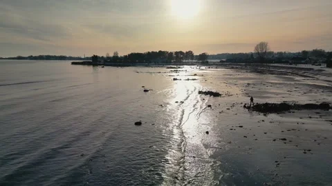 Flying across beach, low sun Stock Footage 232507005