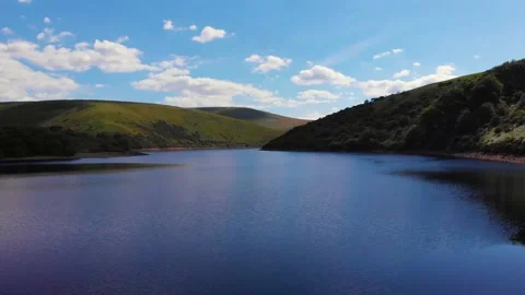 Flying across cloud reflections on Meldon resevoir, Devon, UK 動画素材 135519665