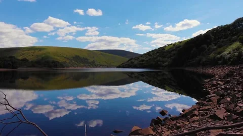 Flying across over cloud reflections on Meldon resevoir, Devon, UK 動画素材 135519644