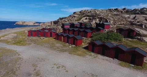 Flying across red fishing huts Stock Footage