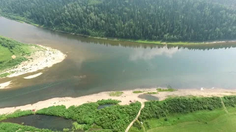 Flying across the river to a pine forest Stock-Footage 68277348