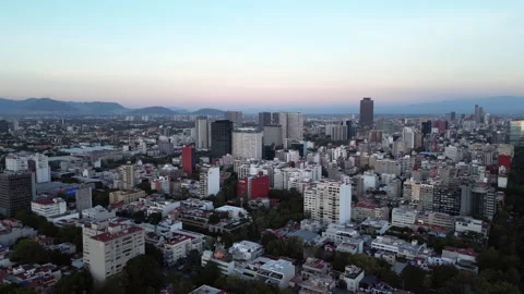 Flying across upscale area in Mexico City in early evening. Stock Footage 306885964