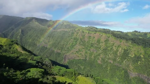 Flying across valley towards a rainbow on Mount Aorai, Tahiti French Polynesia Stock Footage 253171554