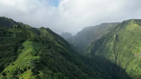 Flying across valley towards a rainbow on Mount Aorai, Tahiti French Polynesia Stock Footage 253171641