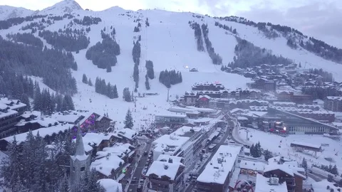 Flying aerial drone Mountains in the French Alps Courchevel Alps ski resort Stock Footage