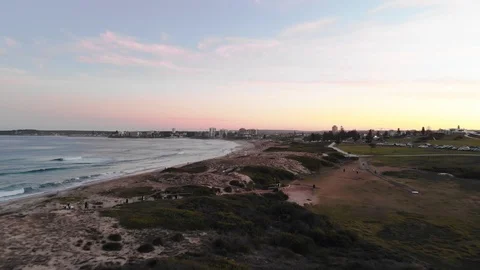 Flying Aerial Drone view of Beach At Sunset In Cronulla, Sydney Australia Stock Footage 99322330