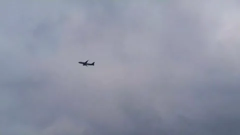 Flying airplane in the cloudy sky. Cloudscape sky with copy space. Airplane.. Stock Footage 281132719