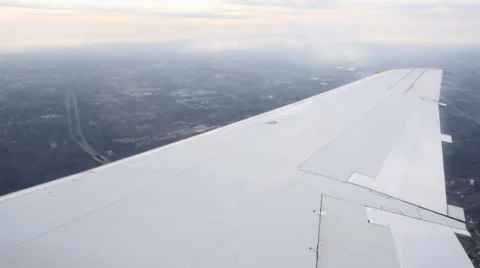 Flying in airplane - plane dips toward ground Stock Footage 46944609