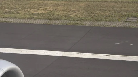 Flying on an airplane. View from plane window. Aircraft landing. Touching runway Stock Footage 121878491