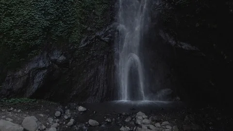 Flying into almost inside to a hidden green Yeh Mempeh waterfall, Bali Stock Footage