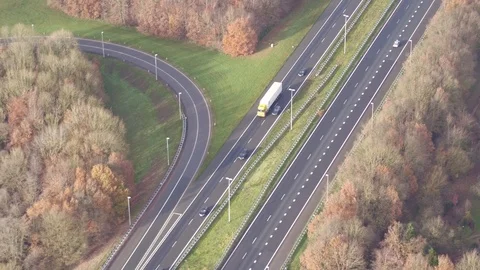 Flying alone an highway thru forrest 動画素材 94826983