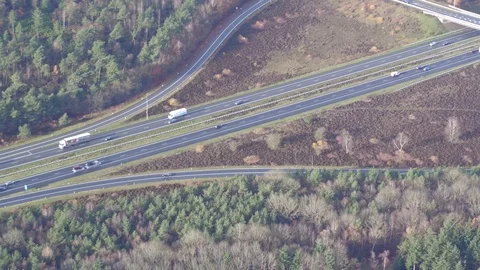 Flying alone an highway thru forrest 動画素材 94827063