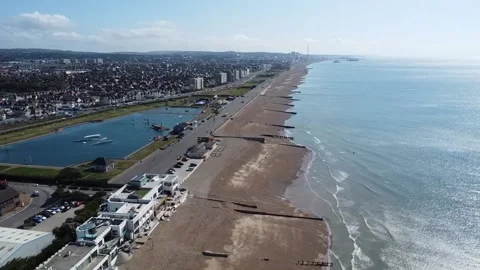 Flying along the beach at Shoreham harbor Stock Footage 195758367