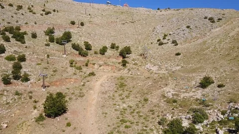 Flying along the cable car lines to the top of Mt. Hermon overlook. DJI_0005-01 스톡 동영상 123848949