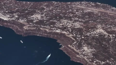Flying along central part of west coast of Santorini, a famous Greek Island 库存影片 338409443
