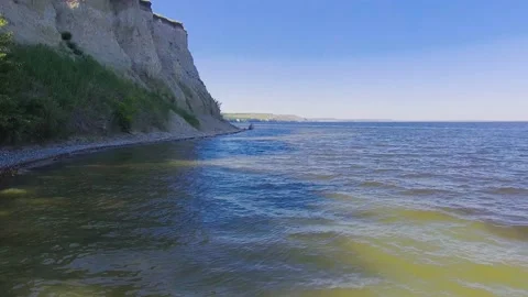 Flying up along the cliff Stock Footage 131116113