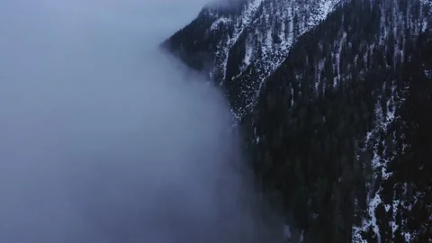 Flying along clouds towards the mountain Video stock 239265570