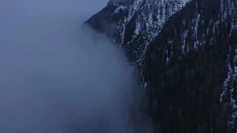 Flying along clouds towards the mountain Video stock 239265571