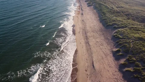 Flying along coastal beach, waves and sand dunes Stock-Footage 323334665