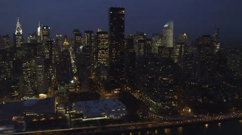 Flying along the East River in New York City at night past landmark skyscrapers, Stock Footage 59170414
