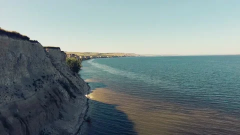 Flying along the edge of a cliff Stock Footage 131116120