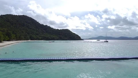 Flying along a floating pier off the coast of a tropical island Stock Footage 172341982
