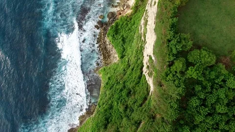 Flying along high cliffs of rocky ocean shore Stock Footage 108676802