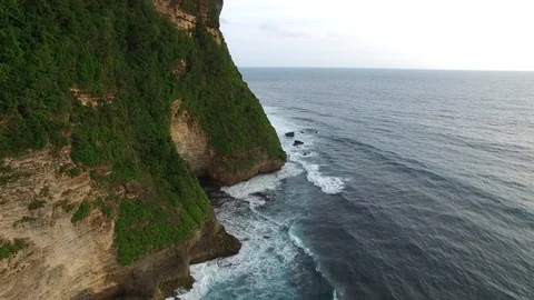 Flying along high cliffs of rocky ocean shore Stock-Footage 108677152