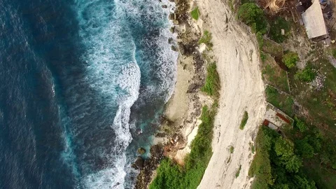 Flying along high cliffs of rocky ocean shore Stock Footage 108677370