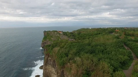 Flying along high cliffs of rocky ocean shore Stock Footage 108677632