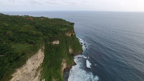 Flying along high cliffs of rocky ocean shore Stock Footage 108678047