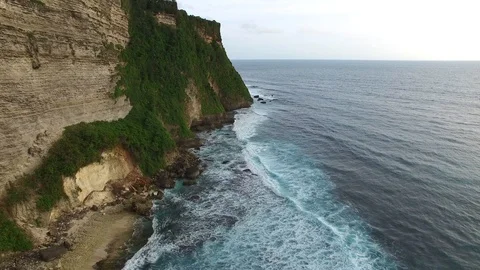 Flying along high cliffs of rocky ocean shore Stock Footage 108680495