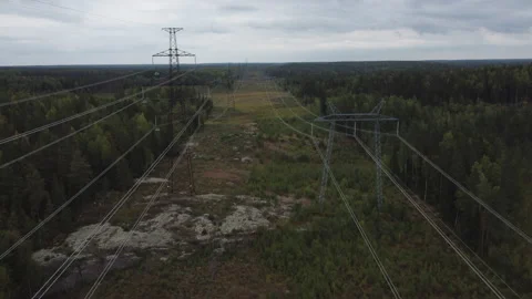 Flying along a high-voltage power transmission line. Drone equipment inspecti Stock Footage 209667566