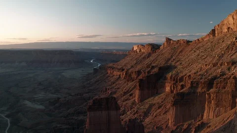 Flying along huge desert cliffs at sunset, Castle Valley, Utah Stock Footage 128661479