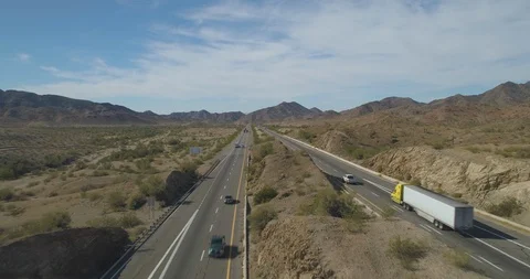 Flying along I-10 between Phoenix and Los Angeles with moderate traffic Stock Footage 99058235