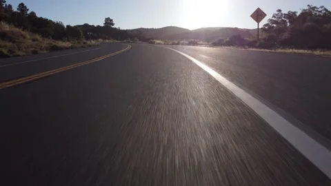 Flying along mountain road surrounded by forest 스톡 동영상 157833729