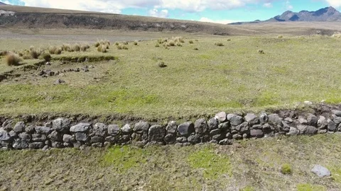 Flying along the perimeter wall of the El Salitre Archaeological Site Vídeo Stock 71558787