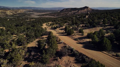 Flying along a remote desert road Stock Footage 157436582