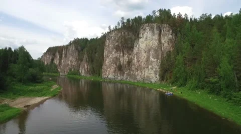 Flying along  river bed next to long cliff 스톡 동영상 65318630