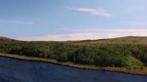 Flying along the river cliff Video stock 112174163