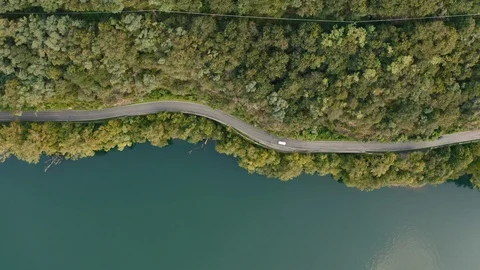 Flying along a road closed to Como Lake, Italy. Aerial view of a forest road Stock Footage 129629465
